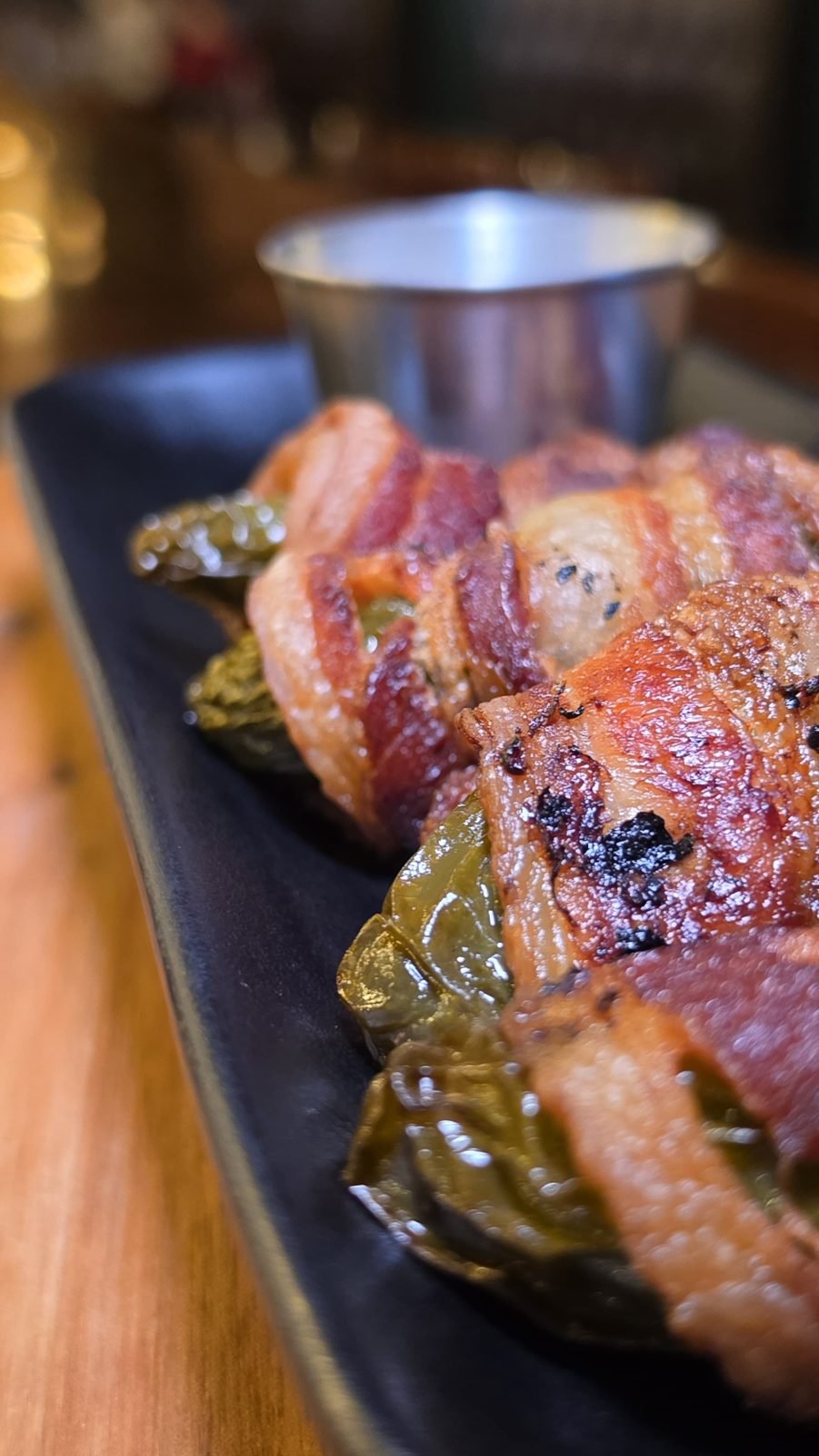 Jalapeño Texas Twinkies stuffed with brisket and cream cheese, wrapped in bacon, at Carnivores Steakhouse in St. Robert, MO